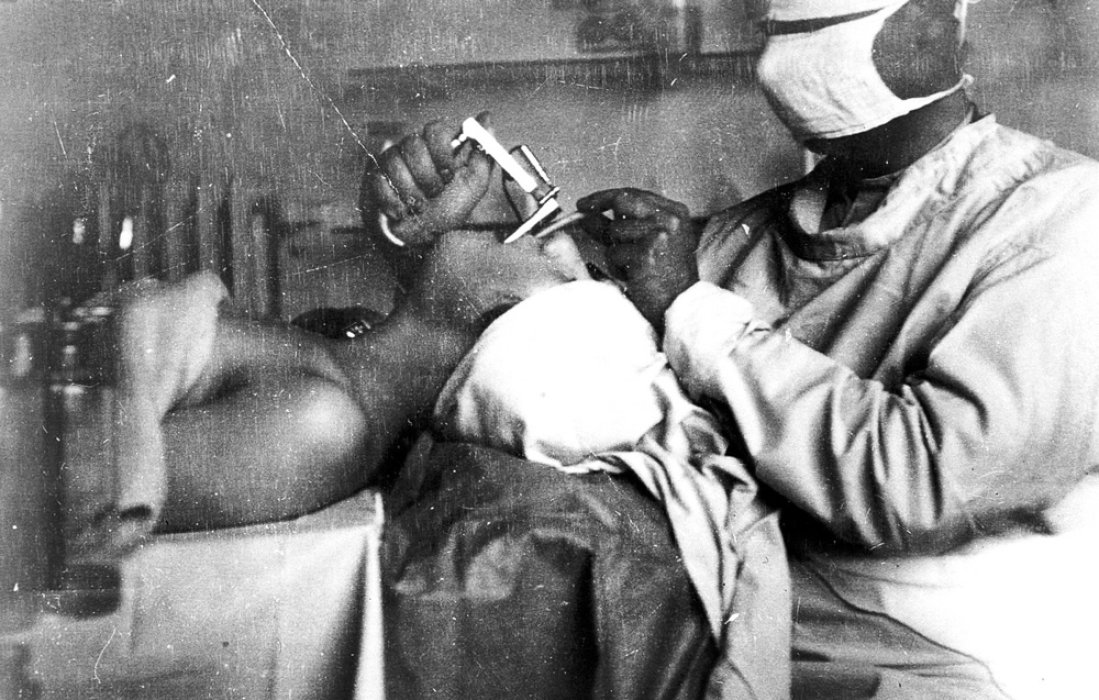 Anaesthetist doing intubation with a laryngoscope